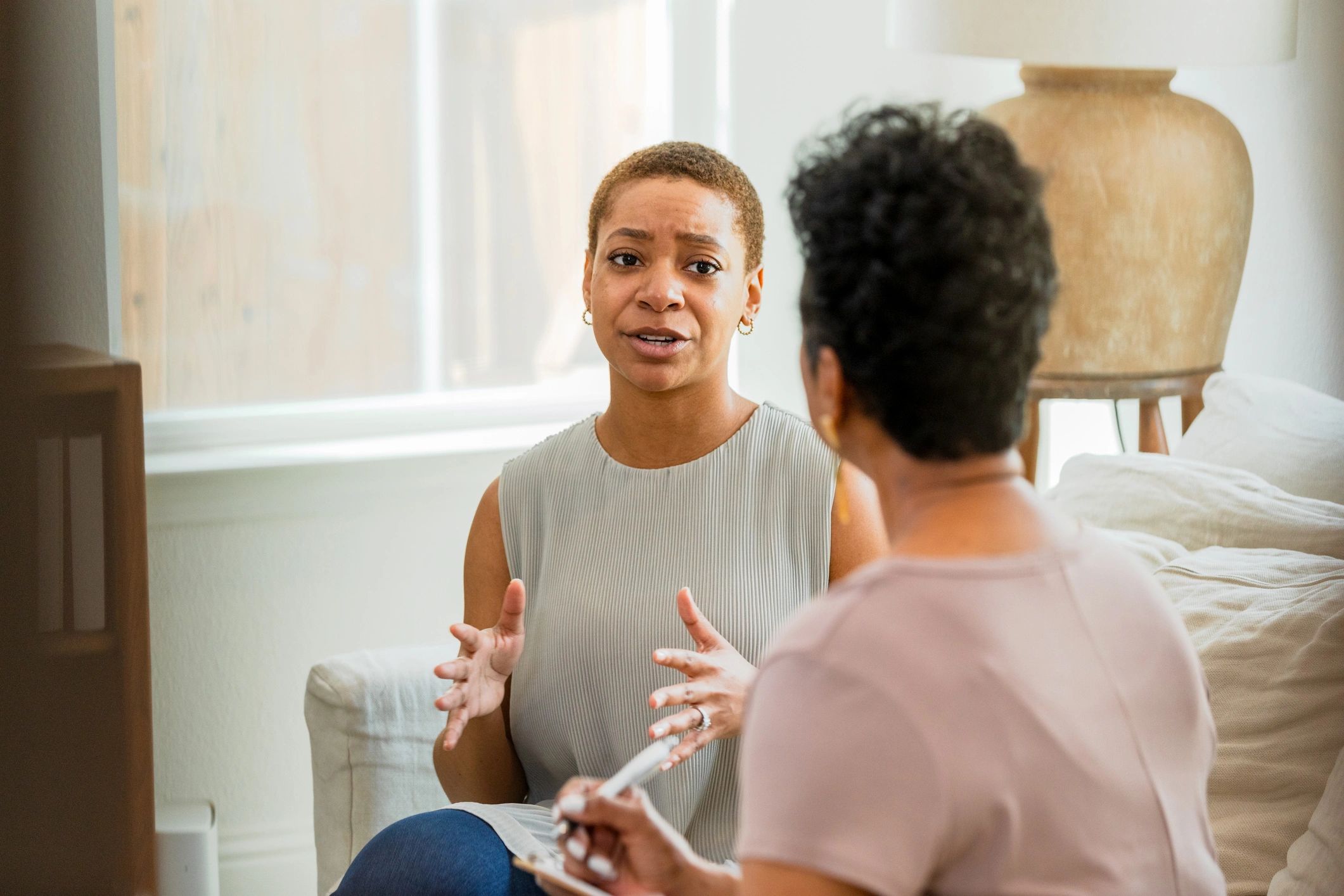 Client speaking with a therapist during a supportive conversation